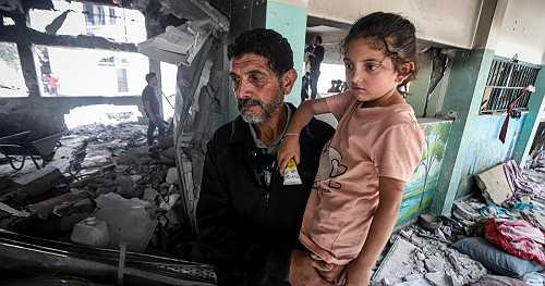 Tiny girl who emerged from flames of Israeli strike on Gaza school-turned-shelter says 